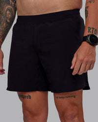 Man wearing Lift Lined 6" Short in Black-Reflective | Size:M