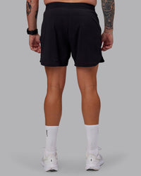 Man wearing Lift Lined 6" Short in Black-Reflective | Size:M