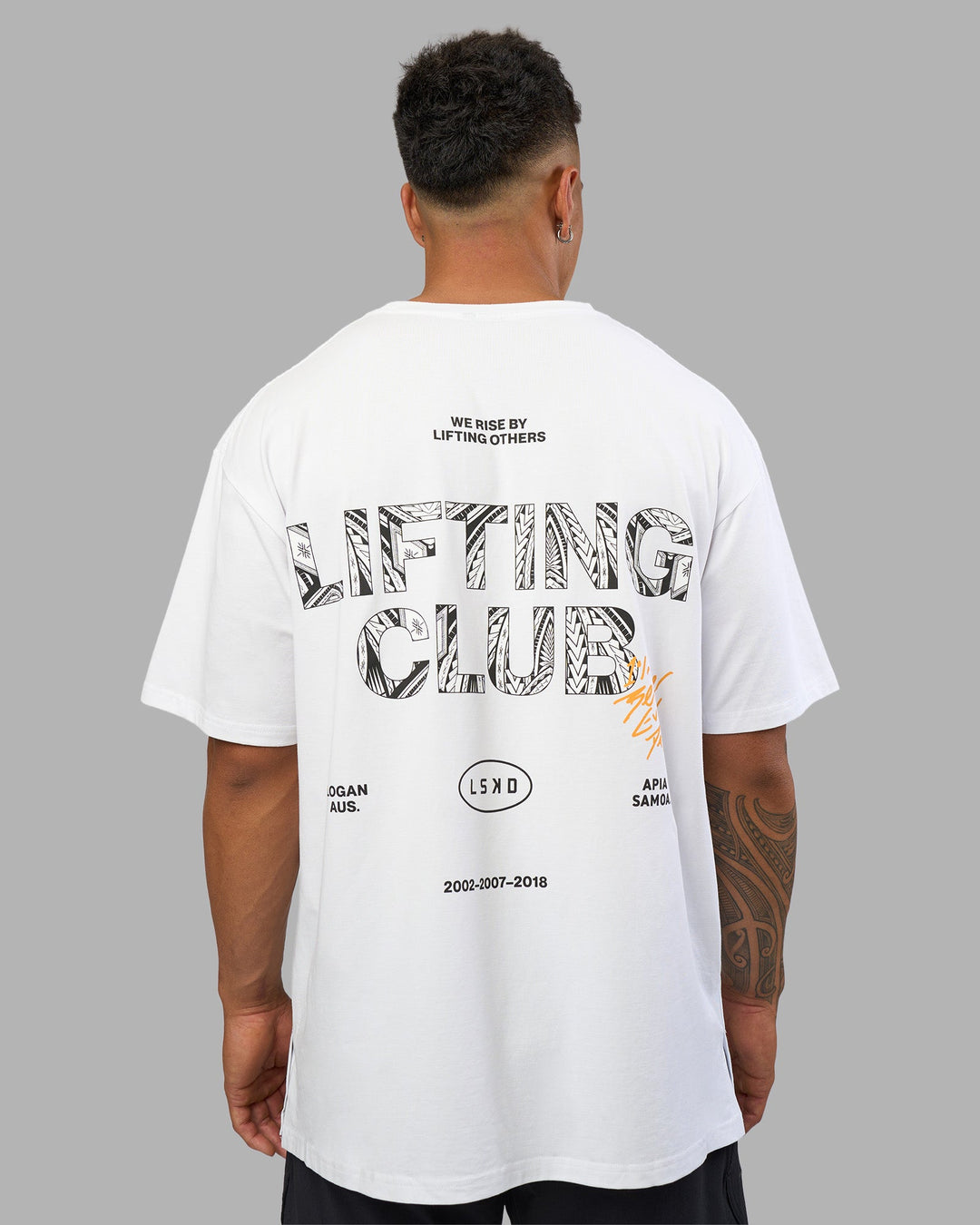 Man wearing Lilz Lifting Club FLXCotton Oversized Tee - White | Model:Daarian | Size:M