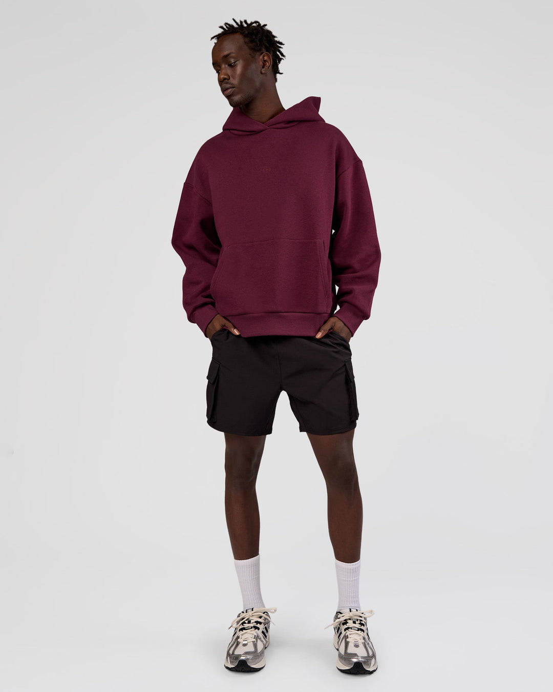 Man wearing MVP Oversized Hoodie - Cherry Lacquer | Model:Okello | Size:M