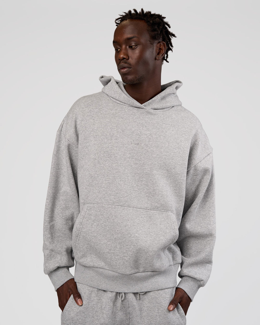 Man wearing MVP Oversized Hoodie - Light Grey Marl | Model:Okello | Size:M
