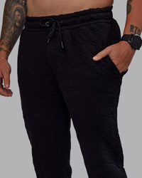 Man wearing MVP Quilted Track Pant - Black-Geometric | Model:Macca | SIze:M