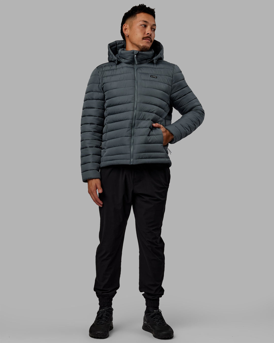 Man wearing All Day Puffer Jacket - Storm