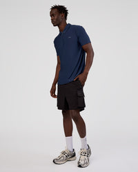 Man wearing Drive Polo - Future Navy | Model:Okello | Size:M