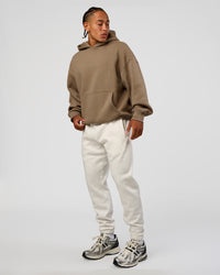 Man wearing MVP Cuffed Track Pant - Silver Marl | Model:Malebo | Size:M