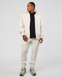 Man wearing MVP Cuffed Track Pant - Silver Marl | Model:Malebo | Size:M