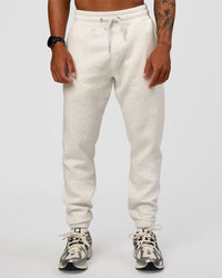 Man wearing MVP Cuffed Track Pant - Silver Marl | Model:Malebo | Size:M