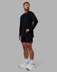 Man wearing Pace Running Long Sleeve Top - Black | Model:Justin | Size:M