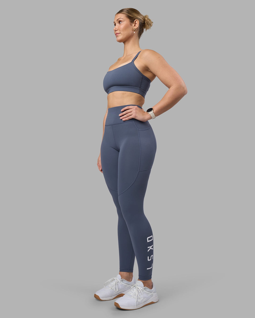 Woman wearing Momentum Sports Bra D/DD/E - Night Shadow | Model:Amy | Size:M