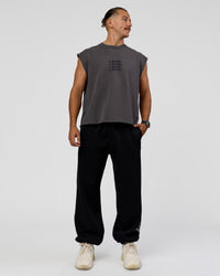 Man wearing Move Fast Heavyweight Boxed Tank - Dark Storm Washed | Model:Jaiden | Size:M