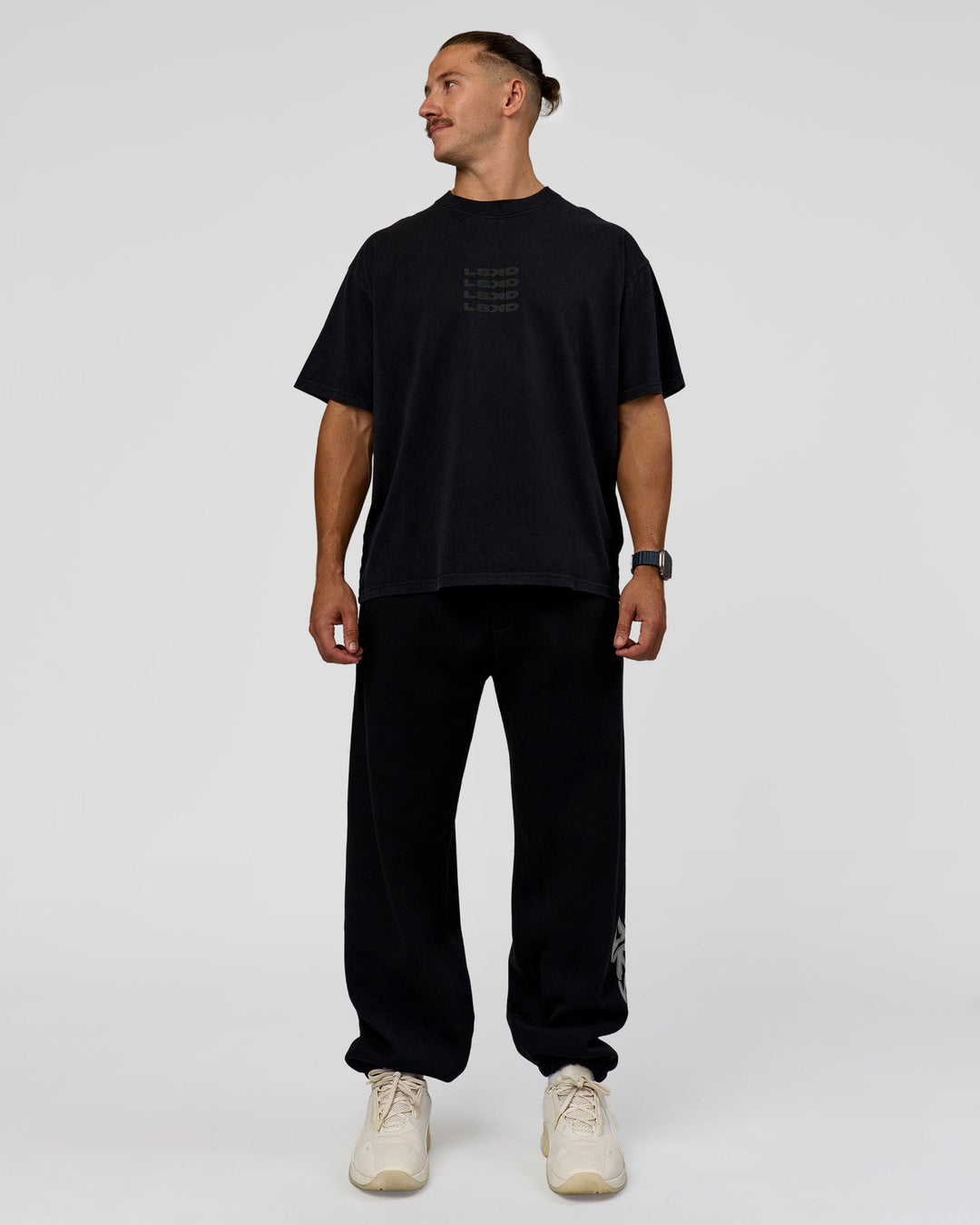 Man wearing Move Fast Heavyweight Oversized Tee - Black Washed | Model:Jaiden | Size:M