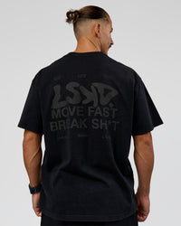 Man wearing Move Fast Heavyweight Oversized Tee - Black Washed | Model:Jaiden | Size:M