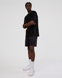 Man wearing Nothing Is Impossible 6" Short - Black-Flame | Model:Okello | Size:M