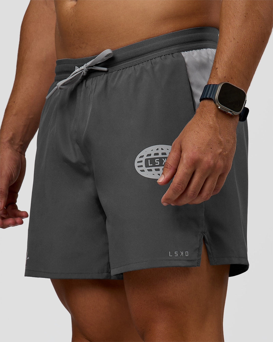 Man wearing Pace 5" Lined Running Short - Dark Storm-Alloy | Model:Jaiden | Size:M