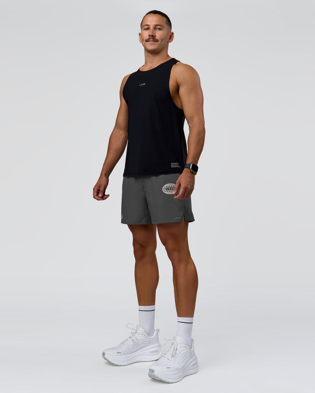 Man wearing Pace 5" Lined Running Short - Dark Storm-Alloy | Model:Jaiden | Size:M