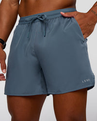 Man wearing Pace 5" Running Short - Blue Mirage | Model:Malebo | Size:M
