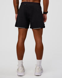 Man wearing Pace Air 5" Lined Running Short - Black | Model:Malebo | Size:M