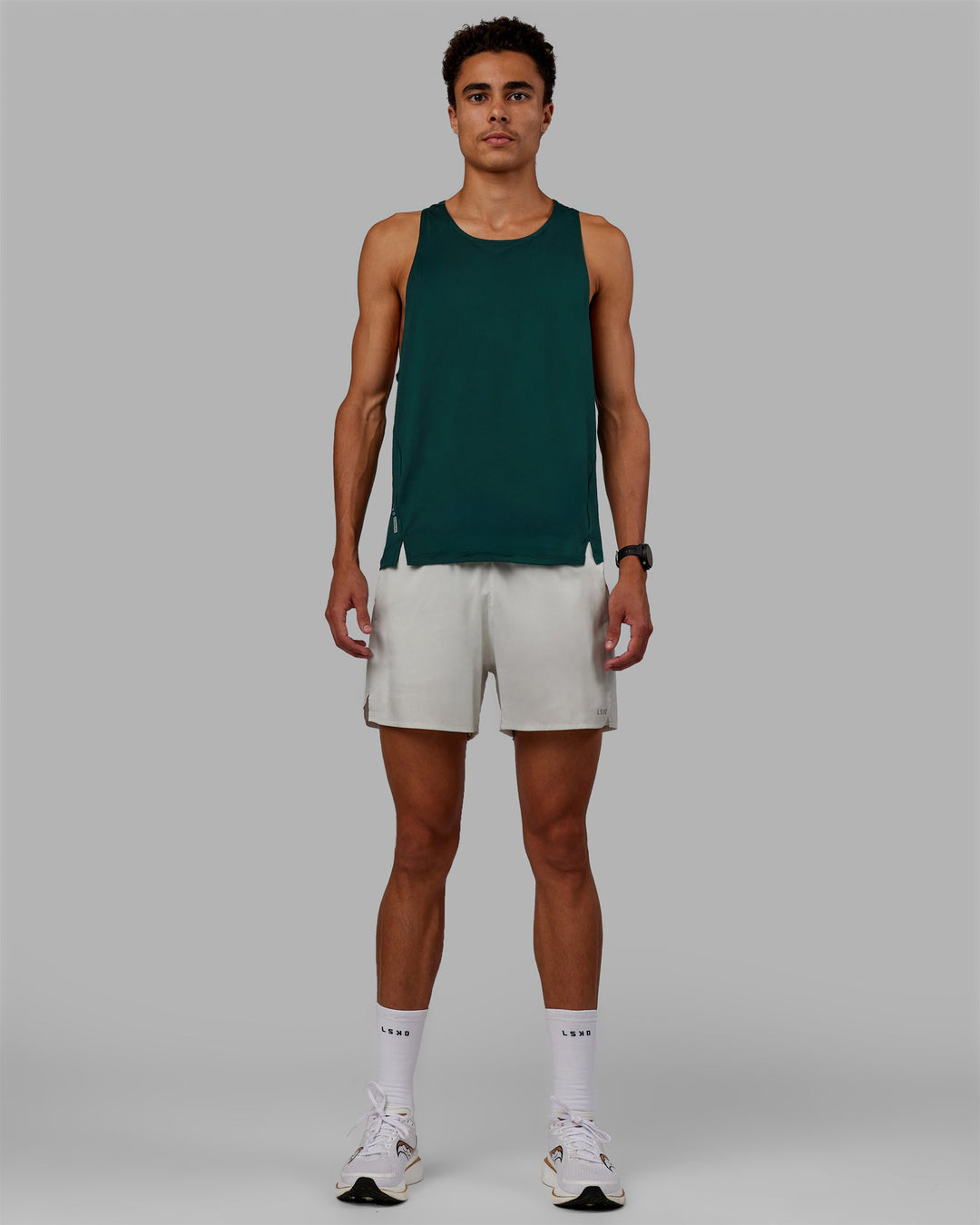 Man wearing Pace Running Tank - Dark Moss