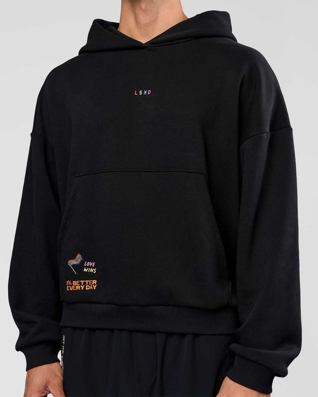 Man wearing Pride Sticker Boxy Hoodie - Black | Model:Albert | Size:M