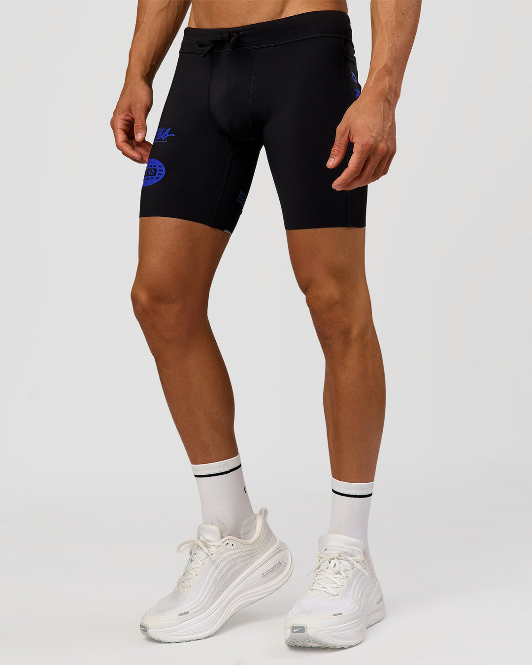 Man wearing Race Day 8" Short Tight - Black-Electric Indigo | Model:Albert | Size:M |