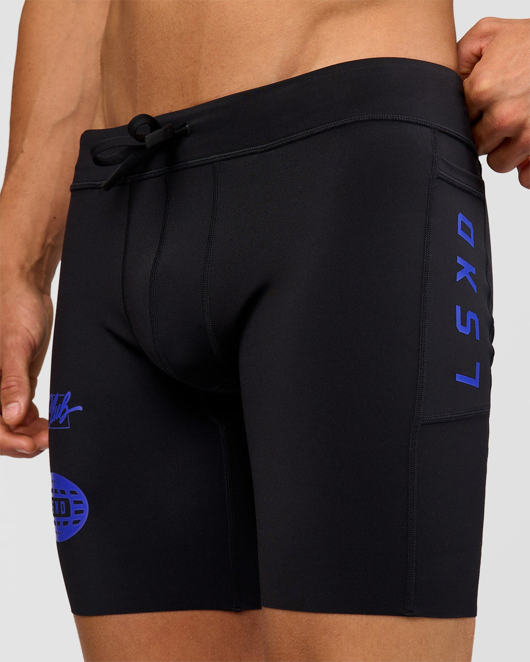 Man wearing Race Day 8" Short Tight - Black-Electric Indigo | Model:Albert | Size:M |