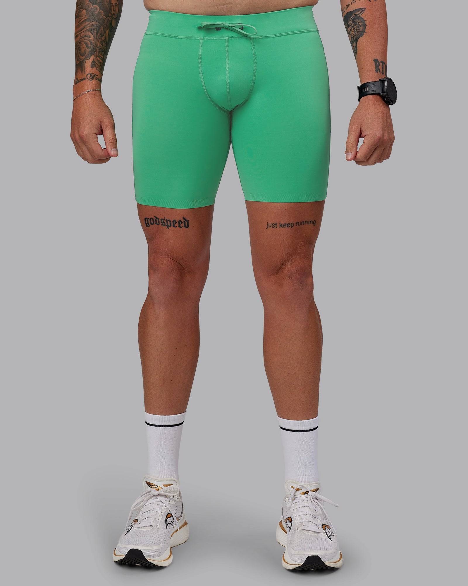 Man wearing Race Day Short Tight 8" in Mystic Green | Size:M