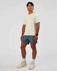Man wearing Rep 5" Performance Short - Blue Mirage | Model:George | Size:M