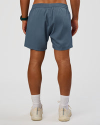 Man wearing Rep 5" Performance Short - Blue Mirage | Model:George | Size:M