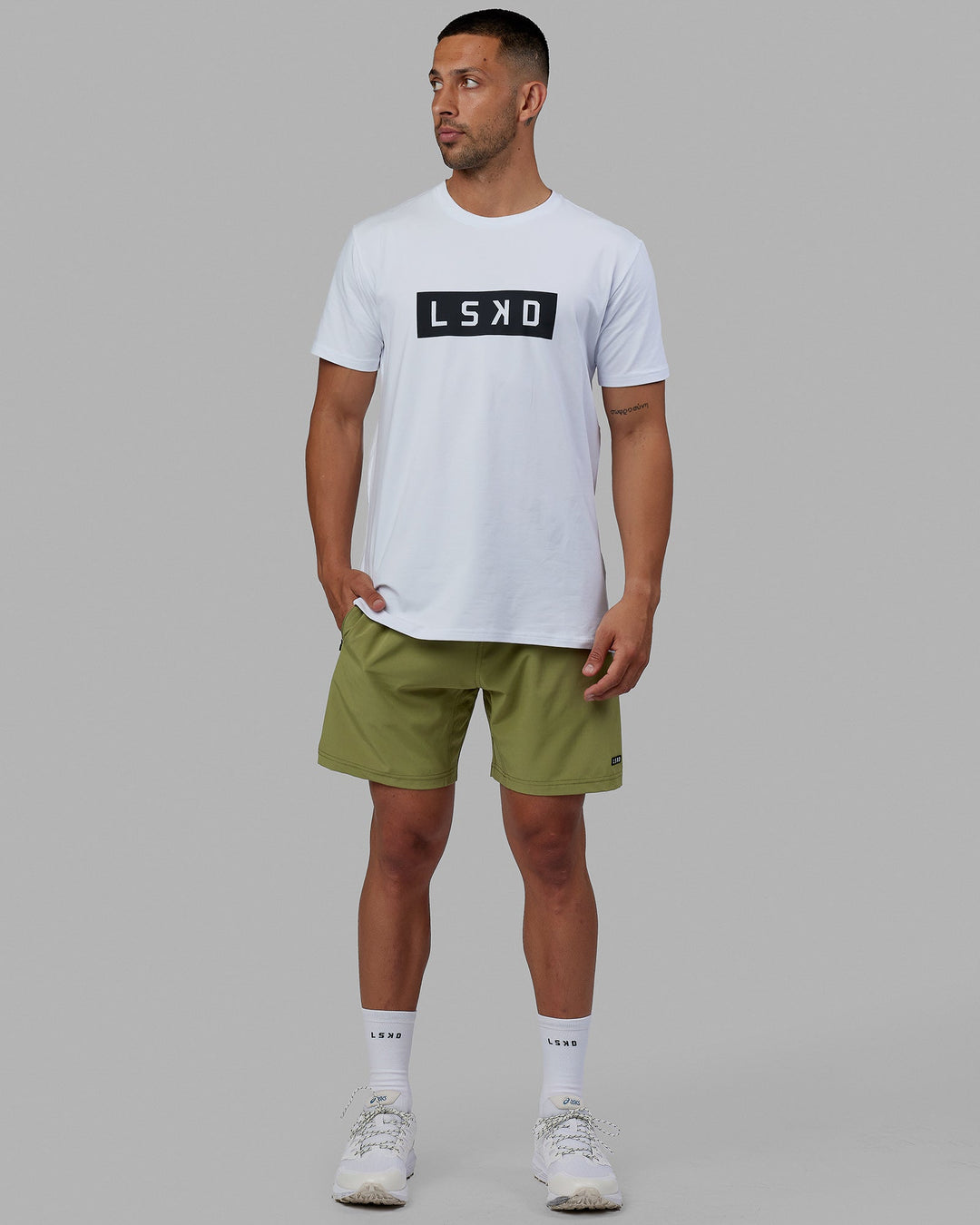 Man wearing Rep 7'' Performance Short - Moss Stone-Lime