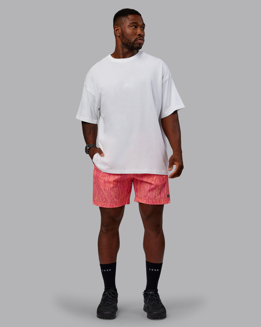 Man wearing Rep 7&quot; Performance Shorts - Topographic Peach