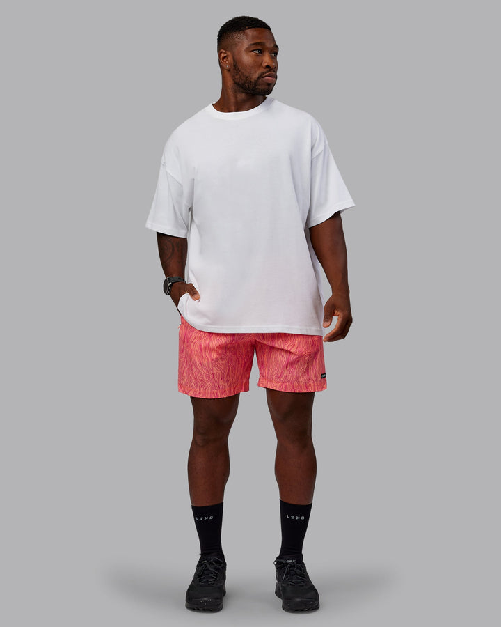 Man wearing Rep 7&quot; Performance Shorts - Topographic Peach
