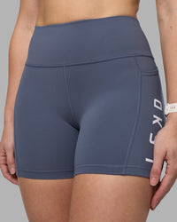 Woman wearing Rep Ultra High-Rise 4" Short Pockets - Night Shadow-White | Model:Amy | Size:M