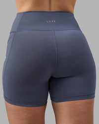 Woman wearing Rep Ultra High-Rise 4" Short Pockets - Night Shadow-White | Model:Amy | Size:M