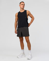 Man wearing Run Club Elevate Pace Running Tank - Black-Onyx | Model:Albert | Size:M
