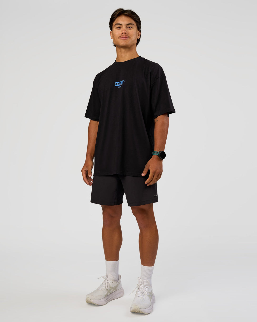 Man wearing Run Club Script FLXCotton Oversized Tee - Black-Palace Blue | Model:George | Size:M
