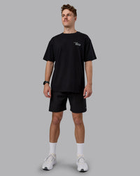 Man wearing Run Love FLXCotton Oversized Tee - Black-Reflective | Model:Cameron | Size:M