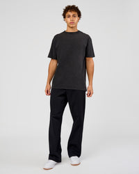 Man wearing Shadow Mode FLXCotton Oversized Tee - Black Washed | Model:Leandro | Size:M