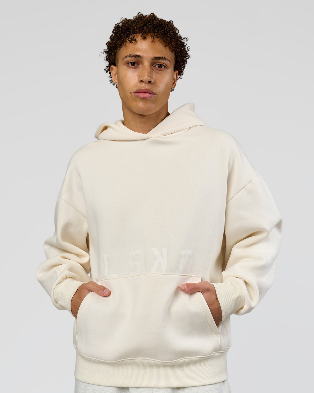 Man wearing Shadow Mode Oversized Hoodie - Off White | Model:Leandro | Size:M