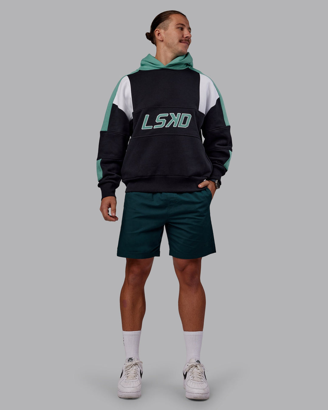 Man wearing Slam Oversized Hoodie - Caviar-Agate Green | Model:Jaiden | Size:M