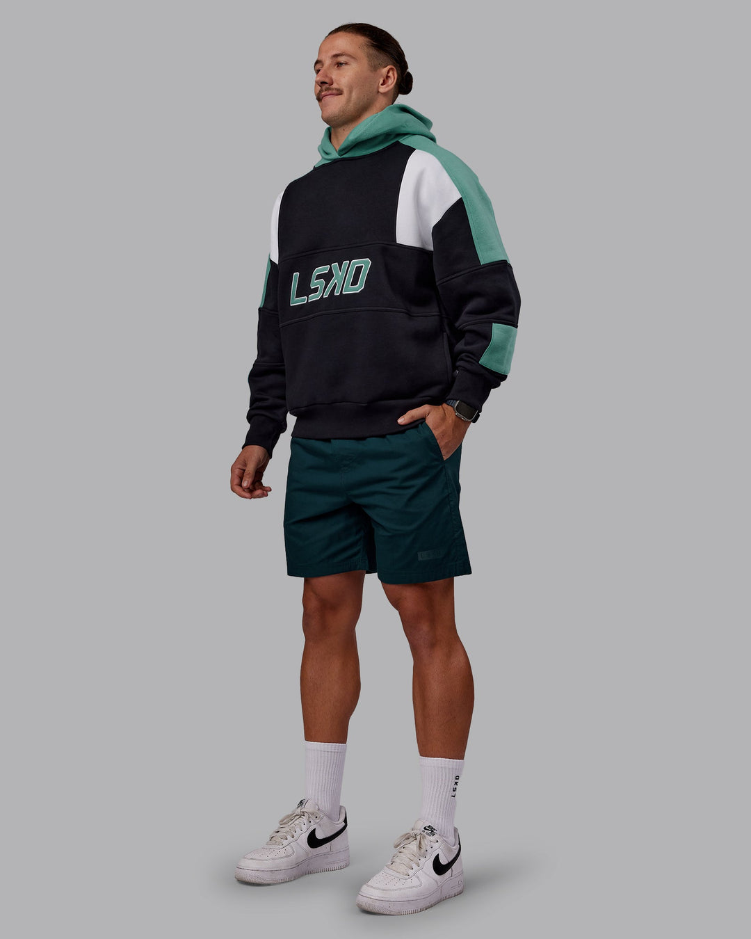 Man wearing Slam Oversized Hoodie - Caviar-Agate Green | Model:Jaiden | Size:M