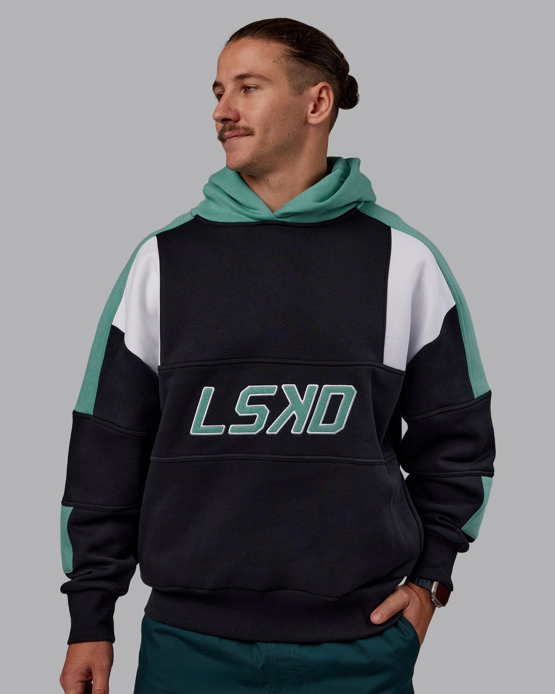 Man wearing Slam Oversized Hoodie - Caviar-Agate Green | Model:Jaiden | Size:M