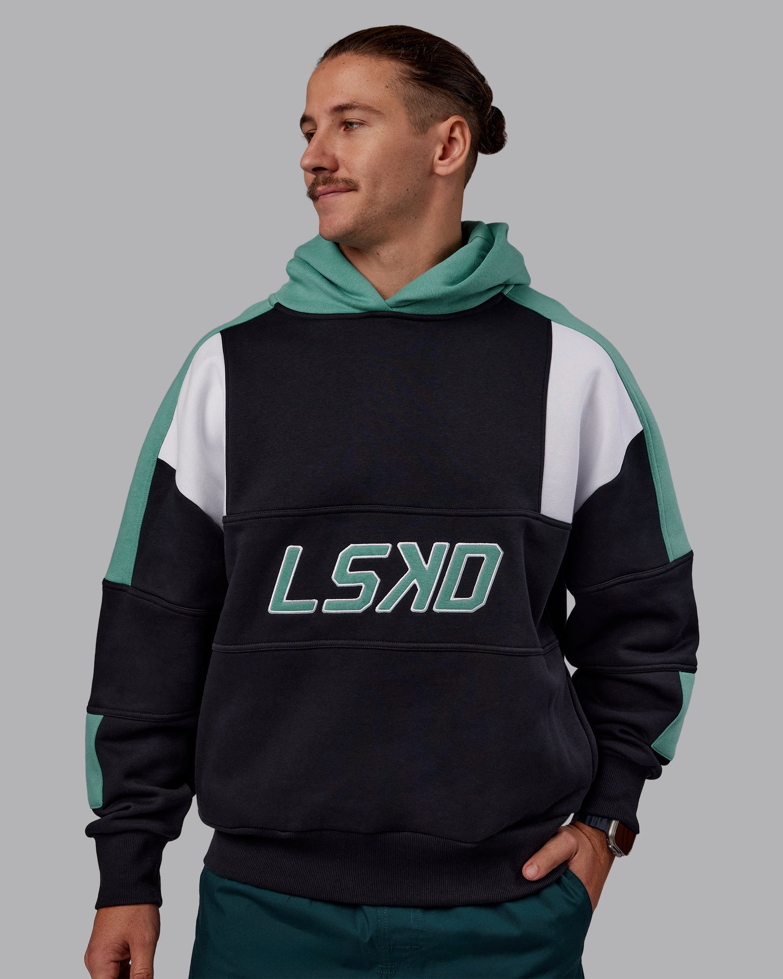 Man wearing Slam Oversized Hoodie - Caviar-Agate Green | Model:Jaiden | Size:M