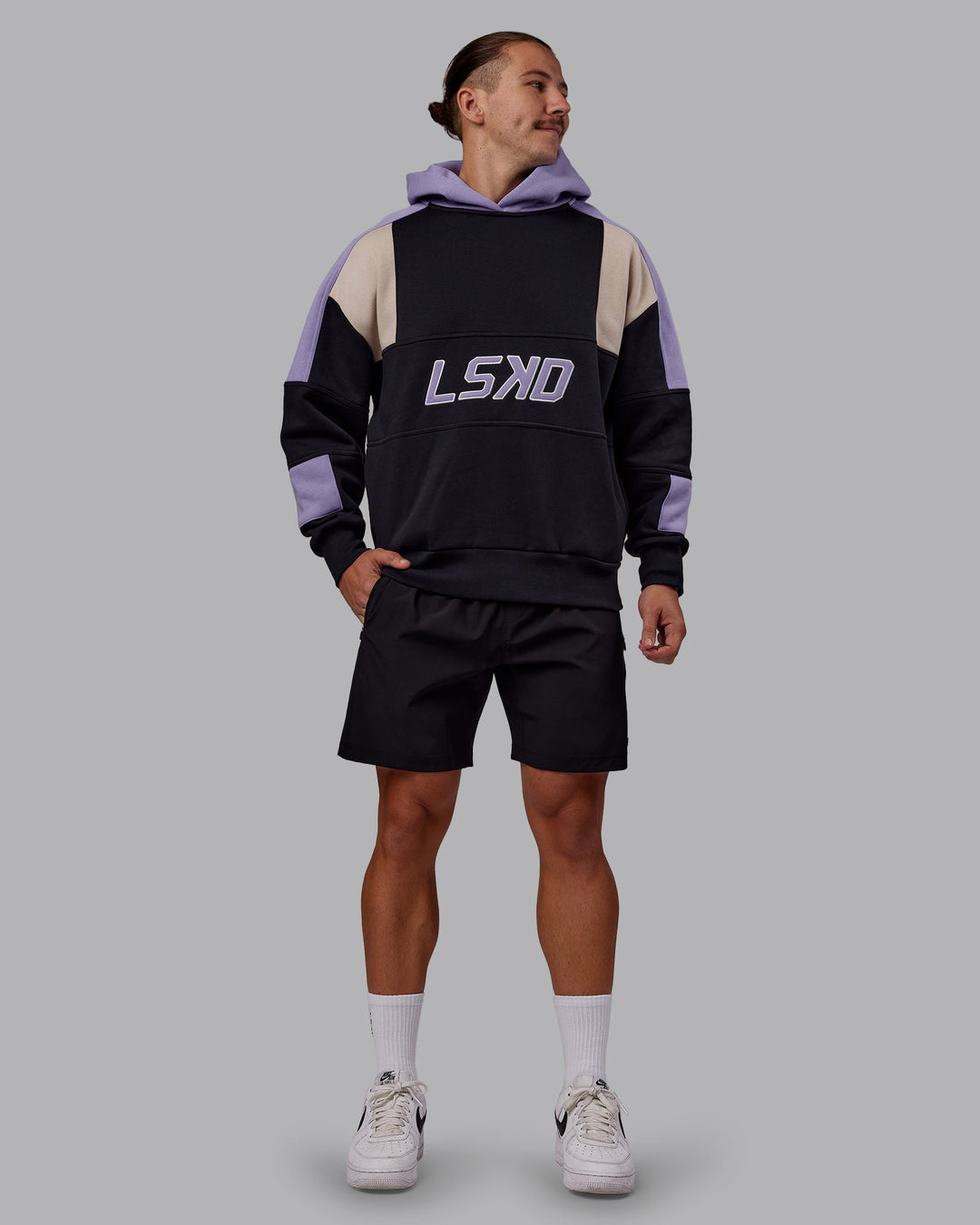 Man wearing Slam Oversized Hoodie - Caviar-Violet Ray | Model:Jaiden | Size:M