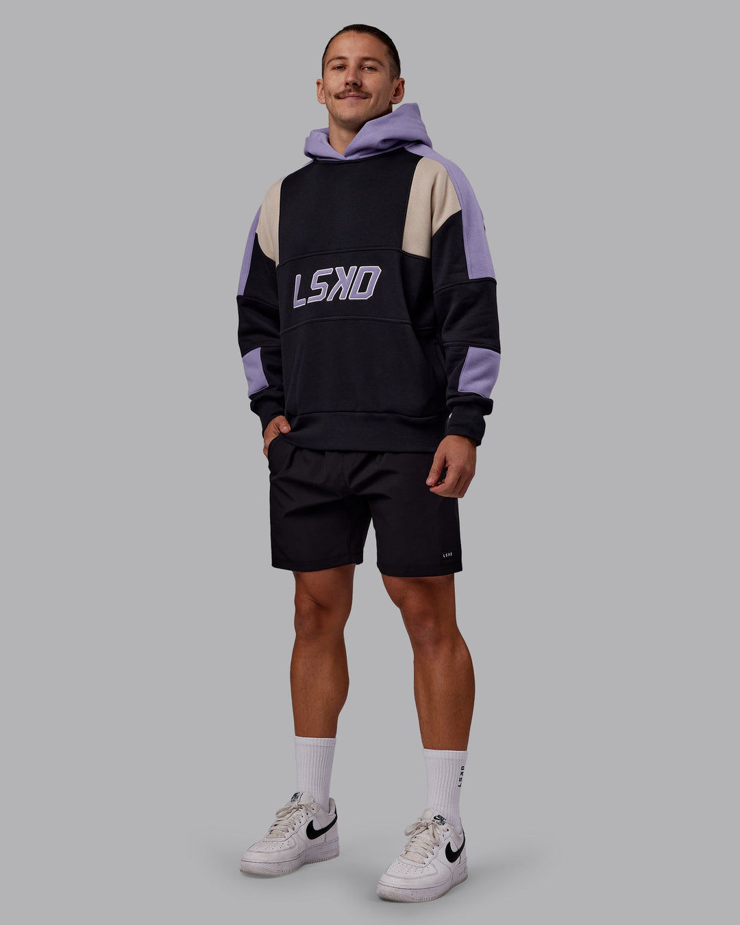 Man wearing Slam Oversized Hoodie - Caviar-Violet Ray | Model:Jaiden | Size:M