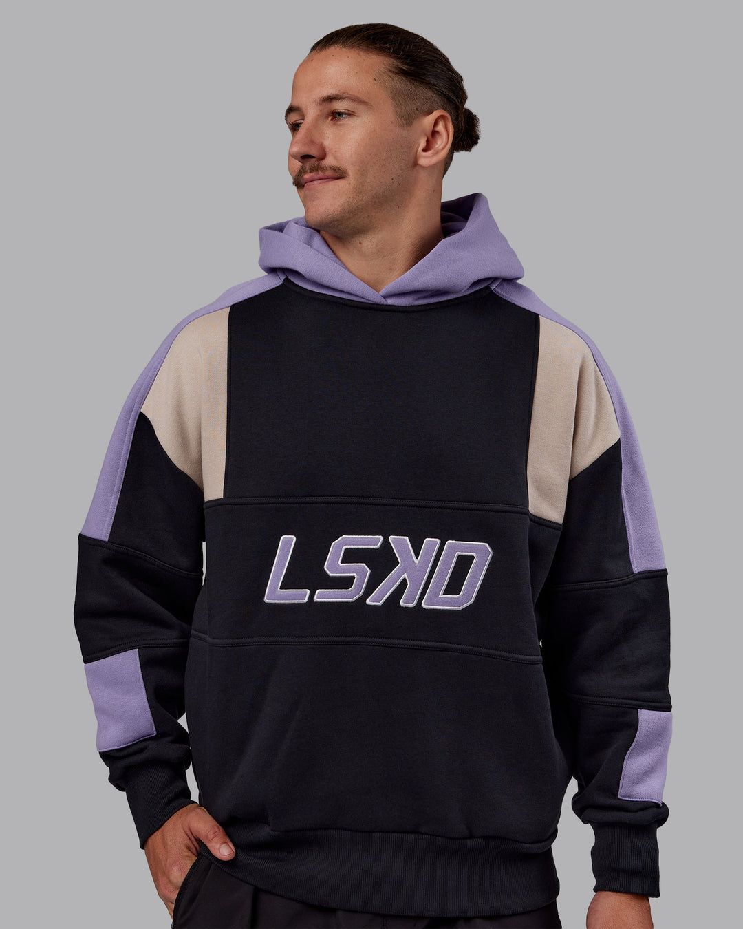 Man wearing Slam Oversized Hoodie - Caviar-Violet Ray | Model:Jaiden | Size:M