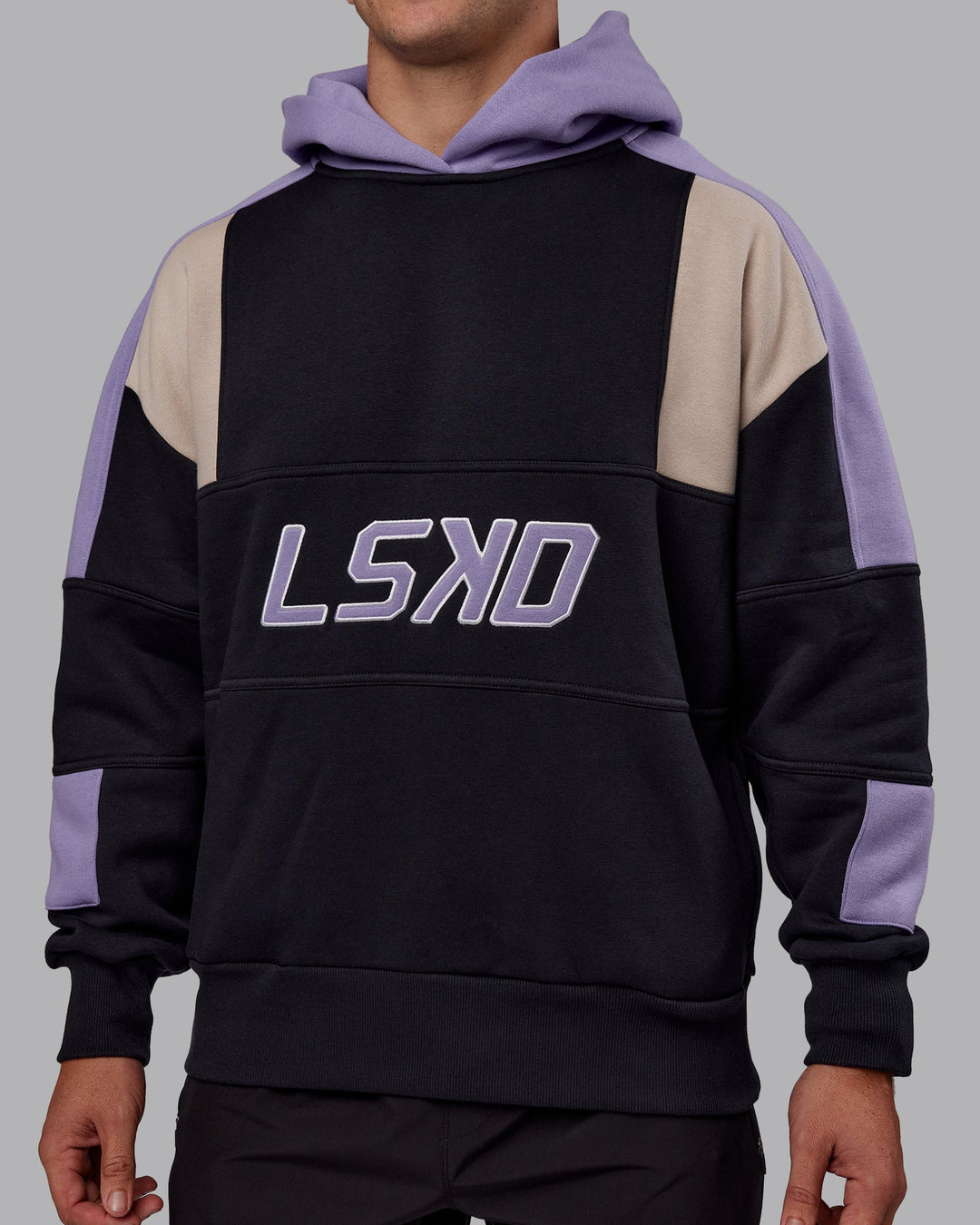 Man wearing Slam Oversized Hoodie - Caviar-Violet Ray | Model:Jaiden | Size:M