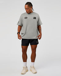 Man wearing Static Grit Heavyweight Oversized Tee - Alloy-Black | Model:Malebo | Size:M