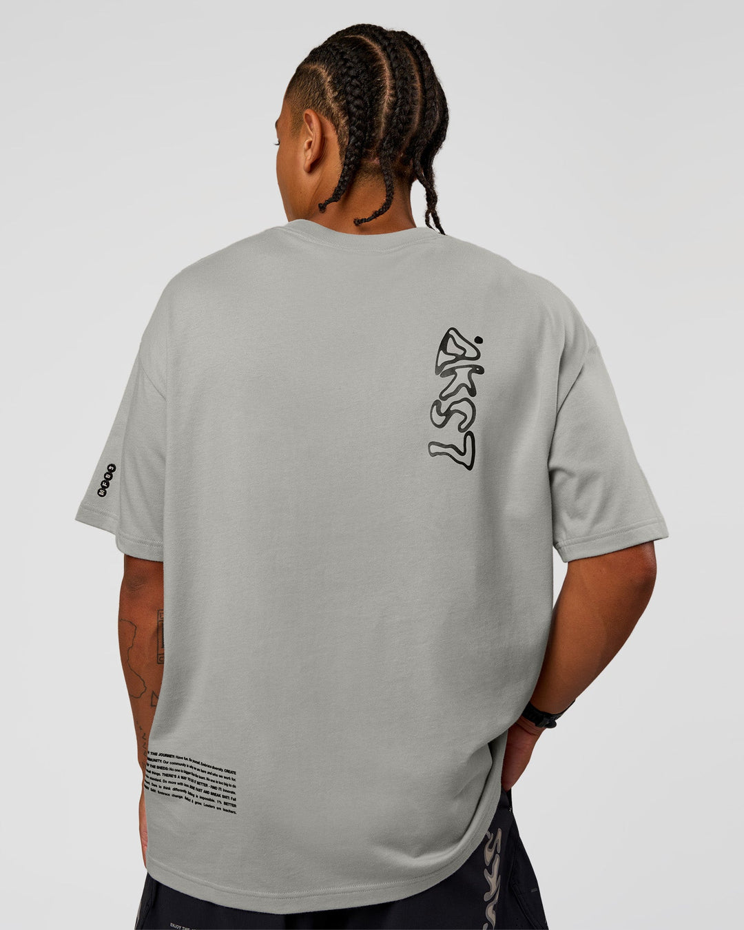 Man wearing Static Grit Heavyweight Oversized Tee - Alloy-Black | Model:Malebo | Size:M
