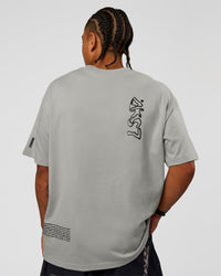 Man wearing Static Grit Heavyweight Oversized Tee - Alloy-Black | Model:Malebo | Size:M