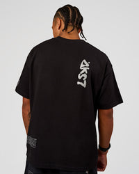 Man wearing Static Grit Heavyweight Oversized Tee - Black-Alloy | Model:Malebo | Size:M